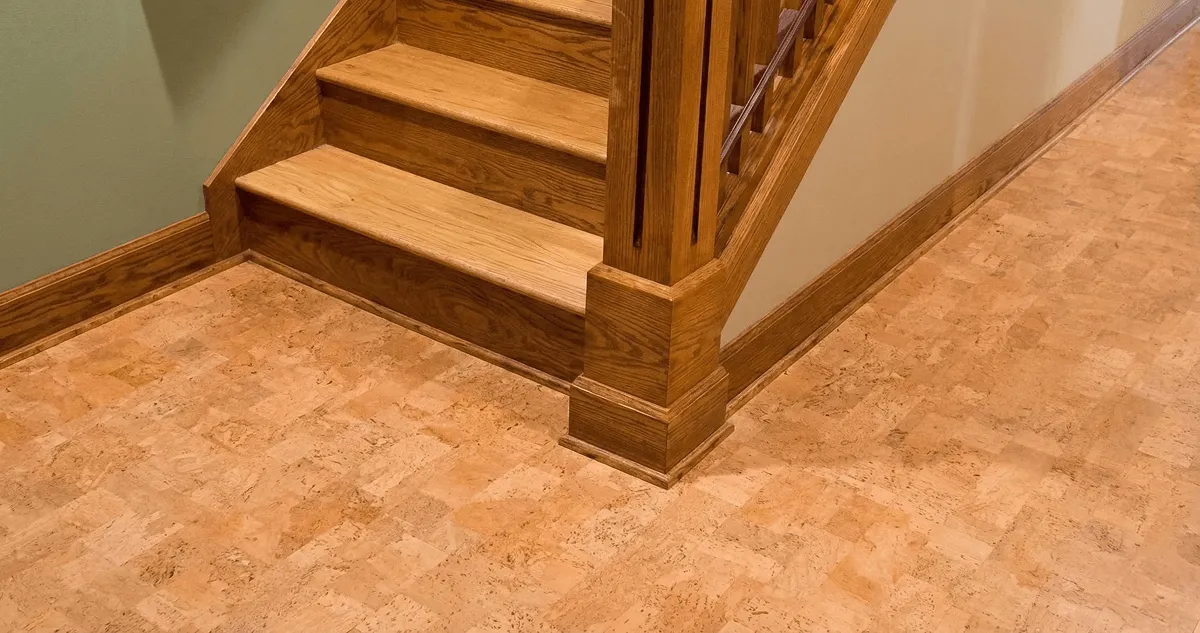 End of a staircase with cork flooring in Cedar Rapids, IA