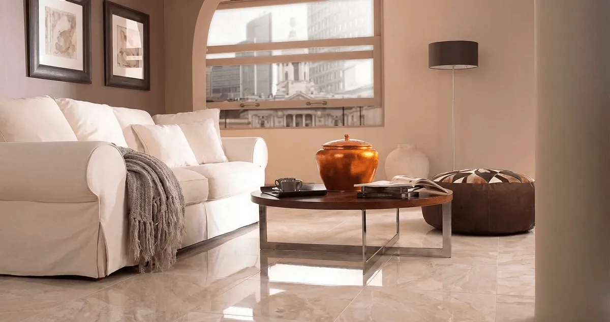 Modern living room with professionally installed marble flooring, a beige sofa, coffee table in Cedar Rapids, IA