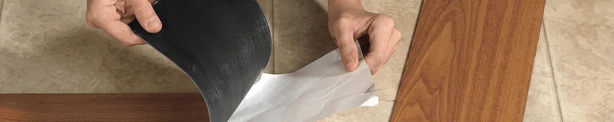 A professional installing vinyl flooring in Cedar Rapids, IA